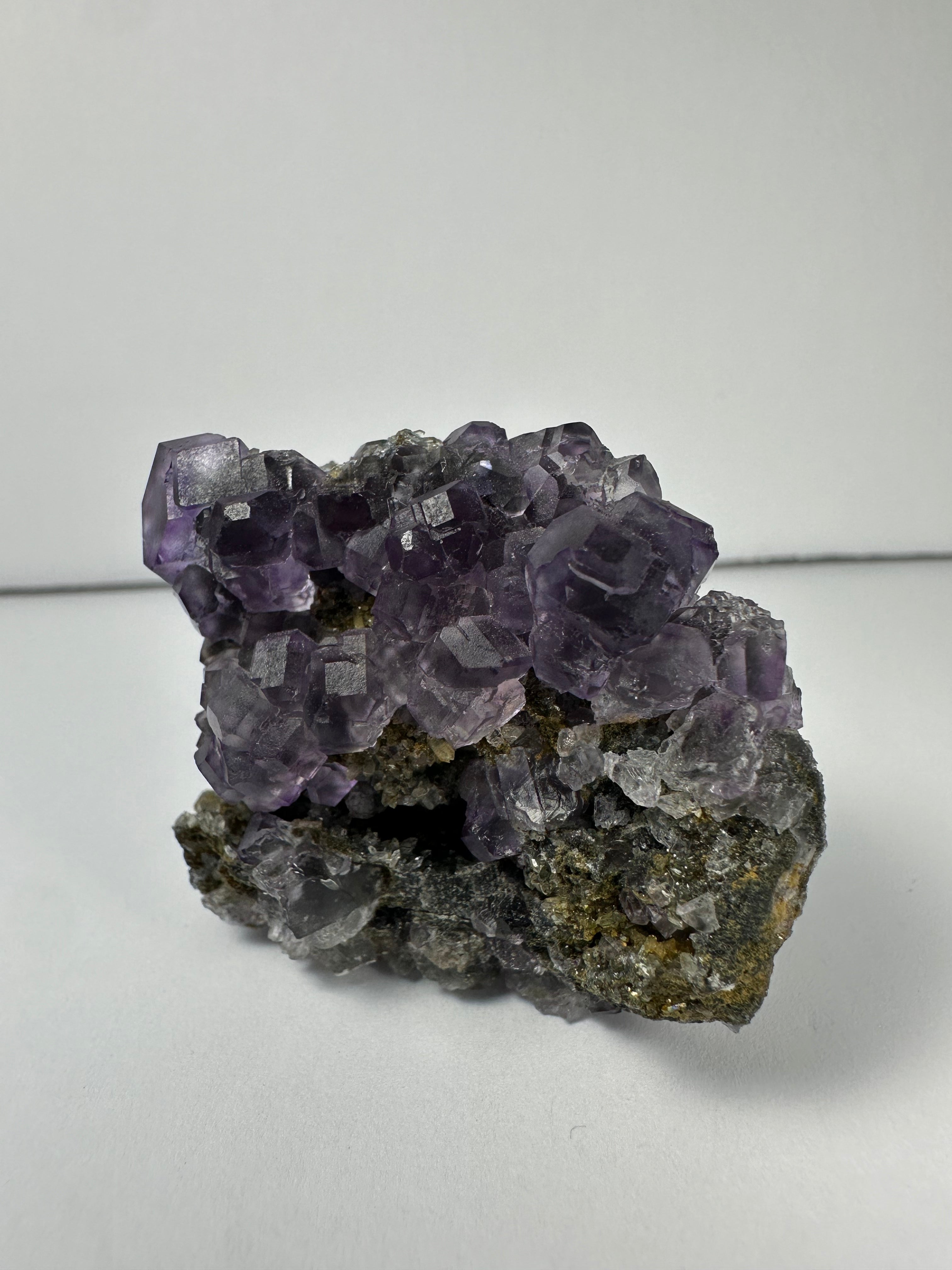 Purple Dodecahedral Fluorite with Calcite on matrix - New Age Realms