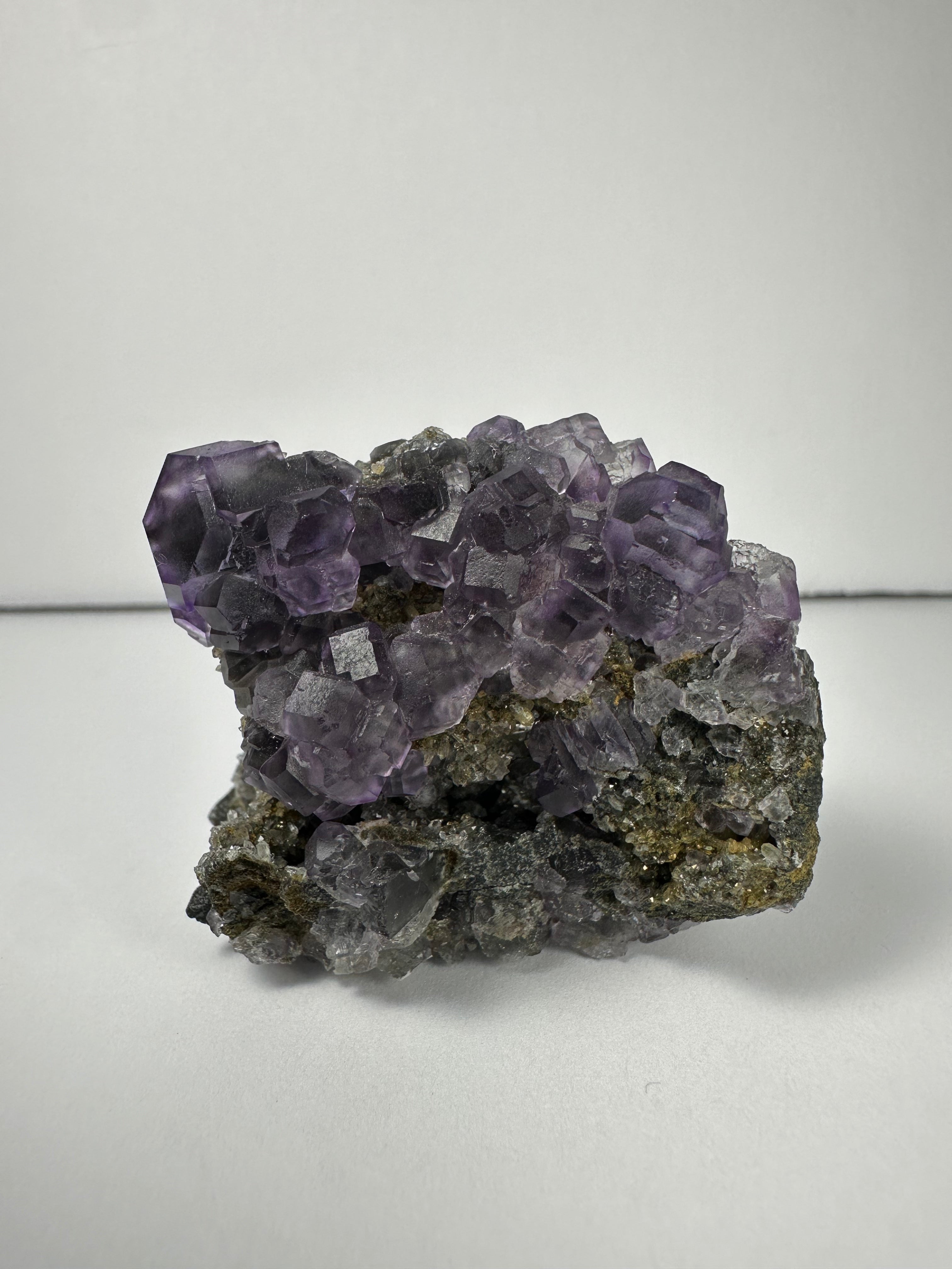 Purple Dodecahedral Fluorite with Calcite on matrix - New Age Realms
