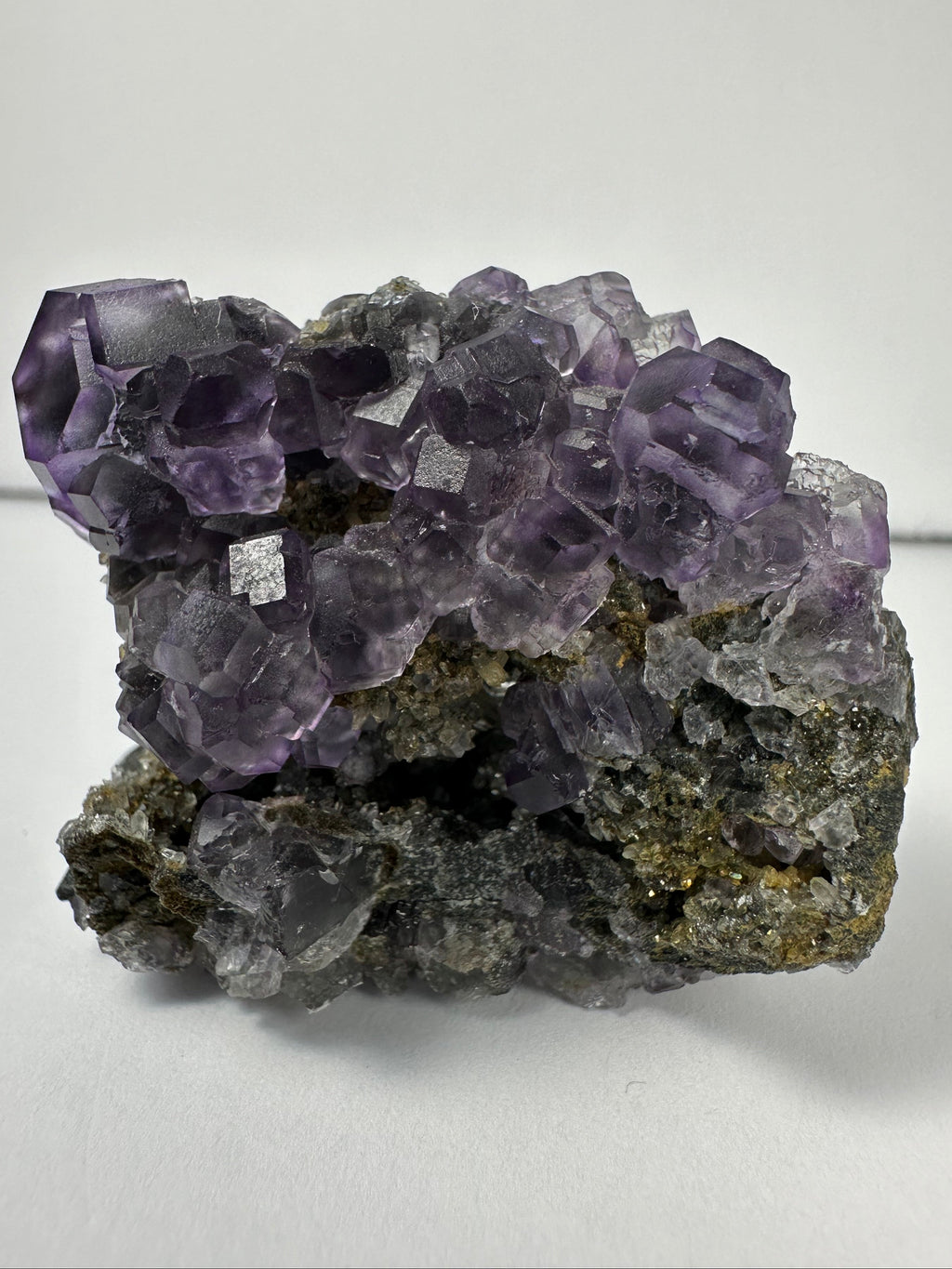 Purple Dodecahedral Fluorite with Calcite on matrix - New Age Realms