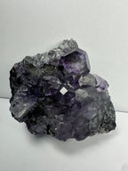 Purple Dodecahedral Fluorite with Calcite on matrix - New Age Realms