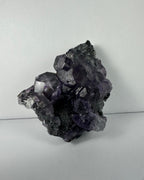 Purple Dodecahedral Fluorite with Calcite on matrix - New Age Realms